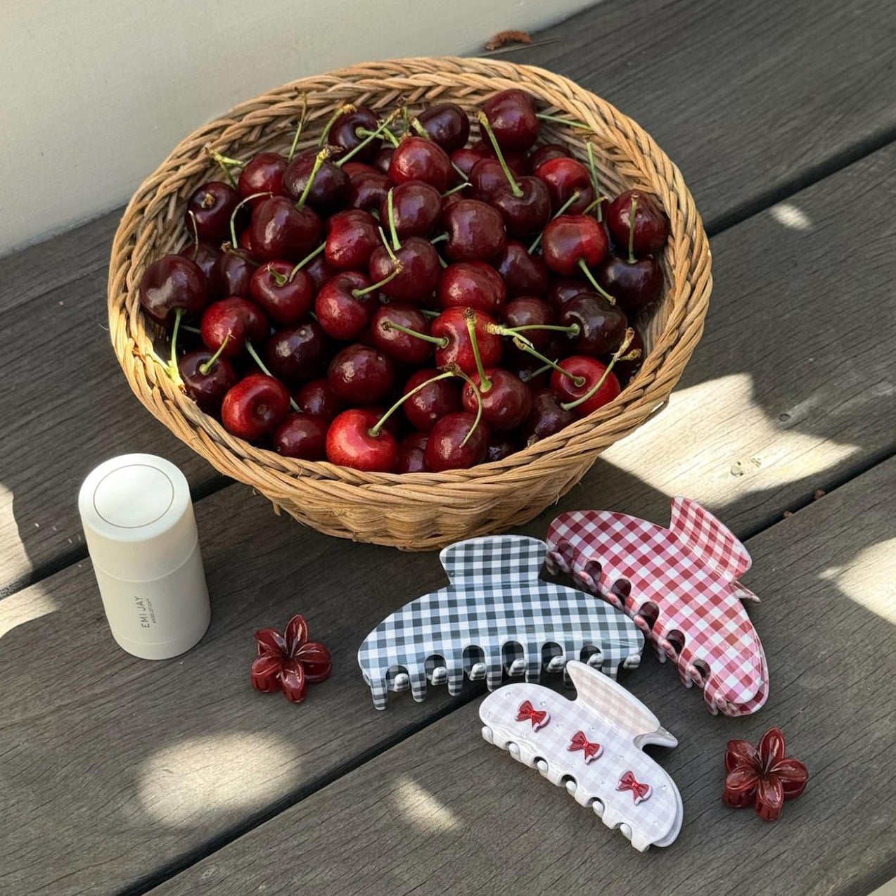 assorted gingham hair clips, angelstick, and a basket of cherries