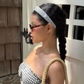 model standing in front of door with Halo Headband in Navy Gingham in hair